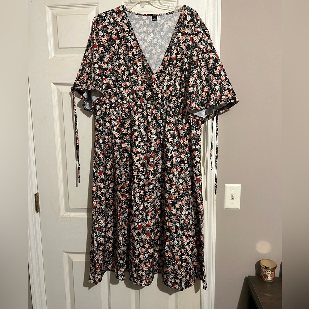 V neck Boho dress with bow knot cold shoulder and whipped waist.